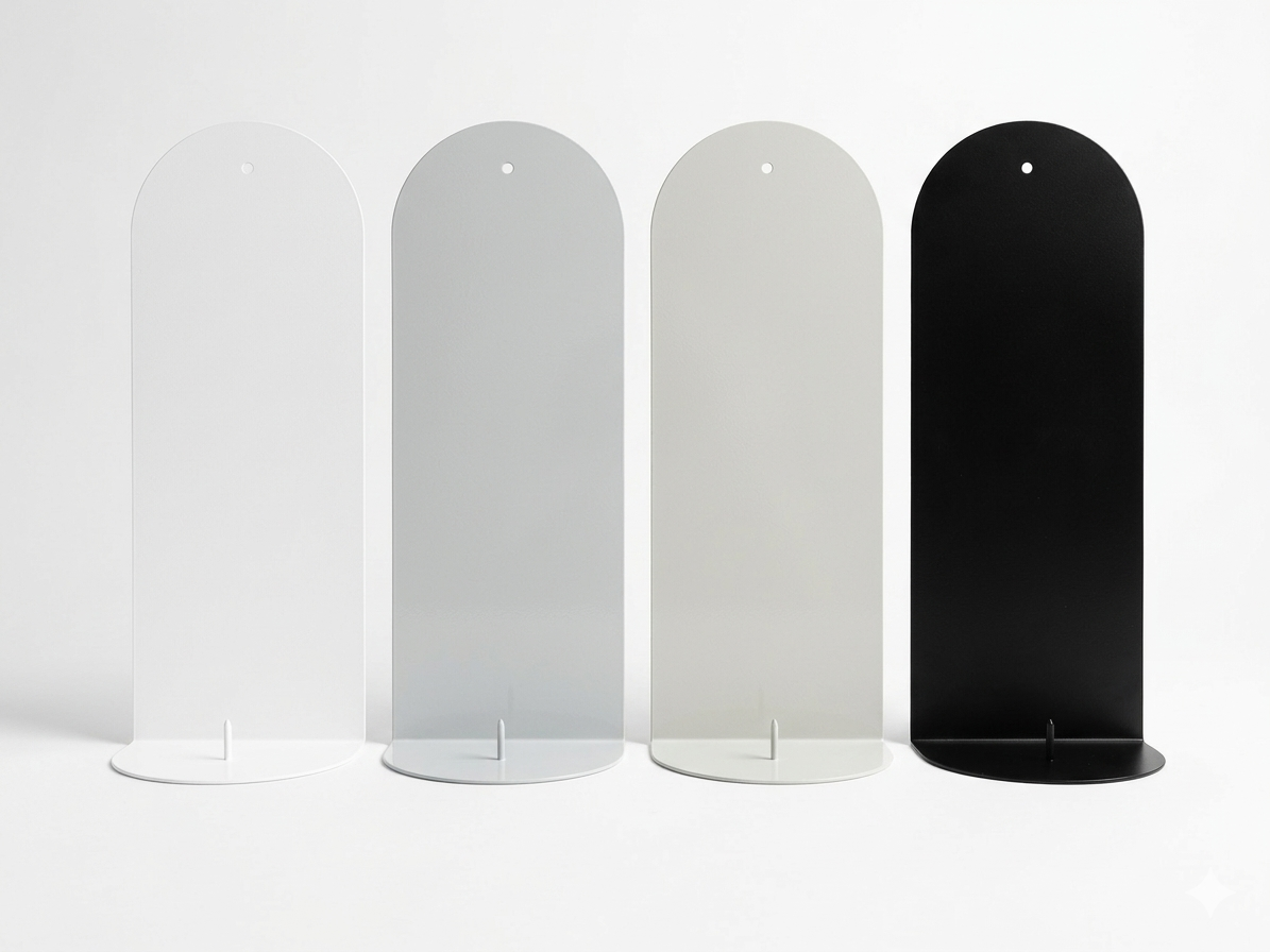 The Bold wall sconce in Stone, Bone White and Black Ink lined up on white background, Nomad Studio.